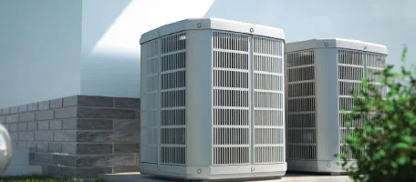 Two sleek outdoor units sit alongside a home, ready to keep the family cool through the summer and warm through the winter.