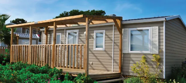 A mobile home with a properly installed HVAC system, showing the outdoor unit and professional installation