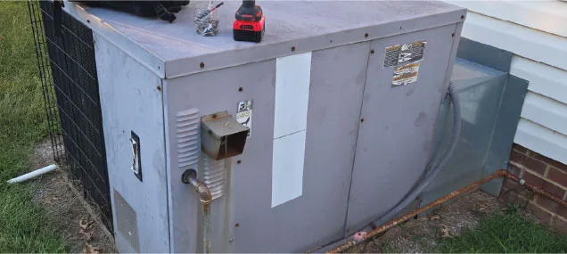 A package unit HVAC system mounted on a rooftop, providing all-in-one heating and cooling for the home below.