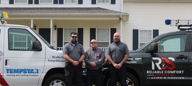 The Reliable Comfort Services team standing together outside their Murfreesboro office, ready to help with your HVAC needs.